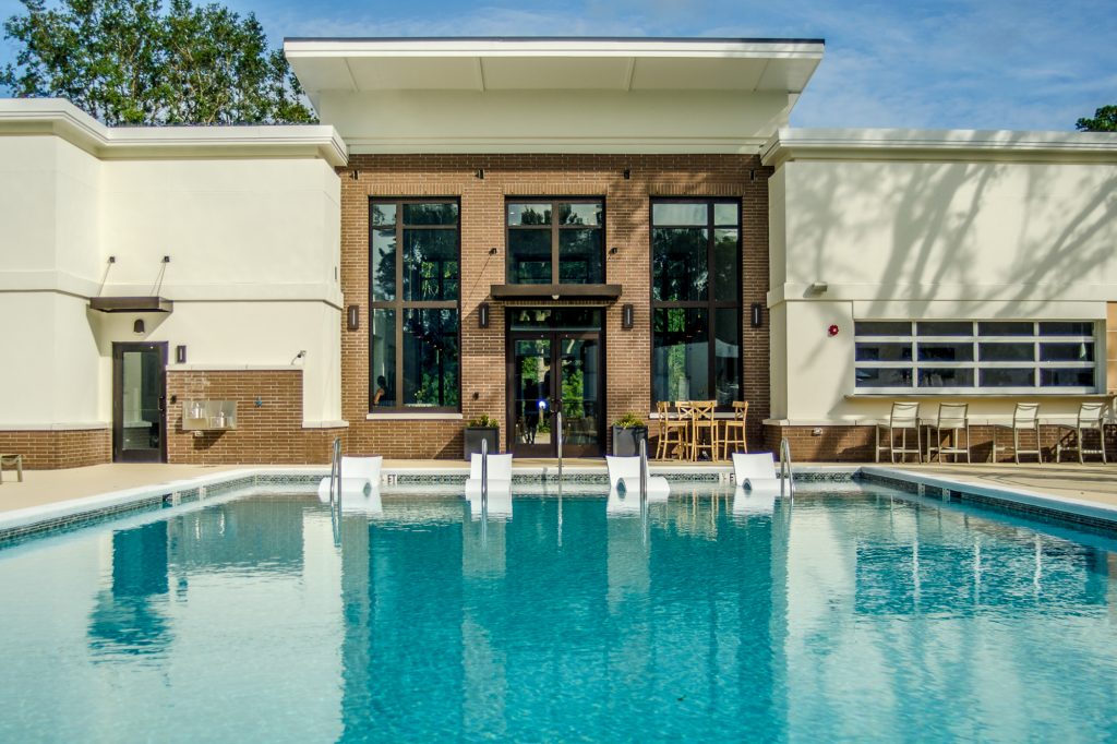 Pool and clubhouse area at 17 South Apartments, an award-winning multifamily ICF development in Charleston
