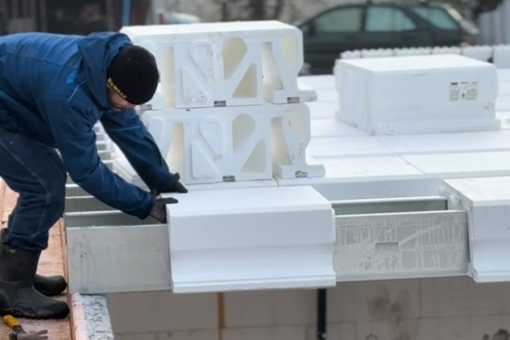 Installer positioning AmDeck Pro EPS roof forms with steel C-channel joists