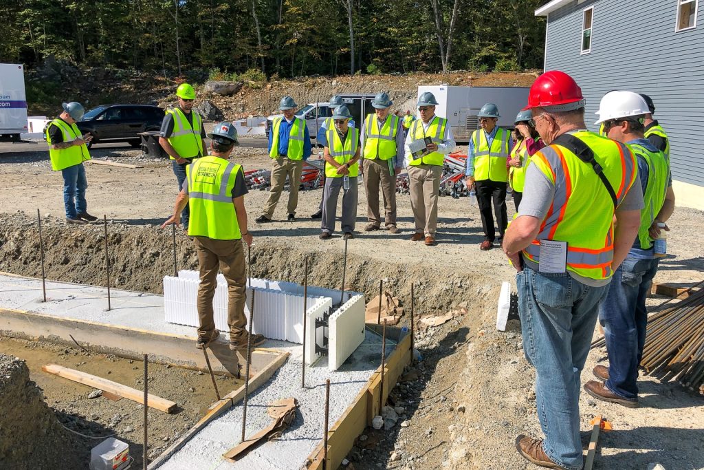 Construction crew reviewing Amvic™ ICF installation at Boulder Farms Townhomes in Johnston, Rhode Island.
