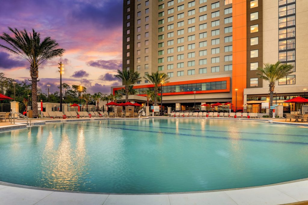 Drury Plaza Hotel pool area with the 15-story hotel tower in Lake Buena Vista, Florida
